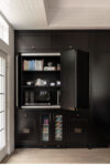 Built-in kitchen cabinetry with concealed appliances, beverage refrigerators, and integrated storage
