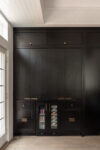 Contemporary Residence Short Hills kitchen cabinetry with concealed appliances, beverage refrigerators, and integrated storage
