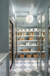 Custom millwork pantry with built-in cabinetry and concealed storage solutions in a transitional family home.
