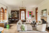Larchmont NY Gatsby Glamour living room featuring Jazz Age butler’s pantry, Art Deco interiors, and large arch windows, showcasing historic home restoration.