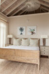 Spacious master bedroom in a luxurious St. John vacation villa with ocean views and coastal interior finishes