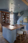 Butler Pantry with island in a Westchester luxury estate featuring shiplap walls, brass finishes, and coastal textures.