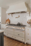 Custom range hood with full oven view in a Westfield Tudor Revival kitchen