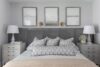 Primary bedroom in grey tones with a king bed in a modern ranch home in Westfield, New Jersey, featuring soft textures and outdoor connection.