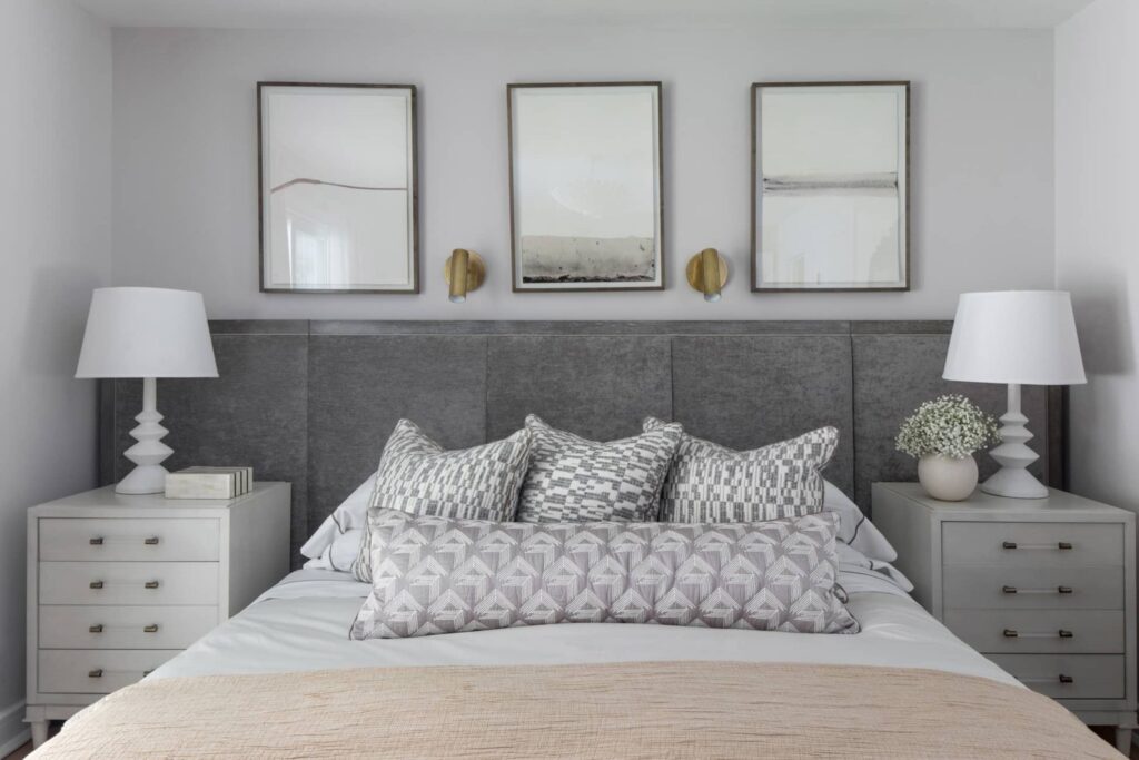Primary bedroom in grey tones with a king bed in a modern ranch home in Westfield, New Jersey, featuring soft textures and outdoor connection.