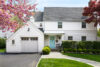 Front view of a renovated 1930s Westfield New Jersey cottage-style home with white exterior, timeless architecture, and classic modern design elements.
