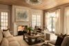 Luxury whole house renovation NJ living room with fireplace, wood ceiling, neutral seating, and large windows