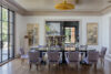 Grand dining room with steel-framed windows, coastal interiors, and nautical design elements in a Westchester heritage home.