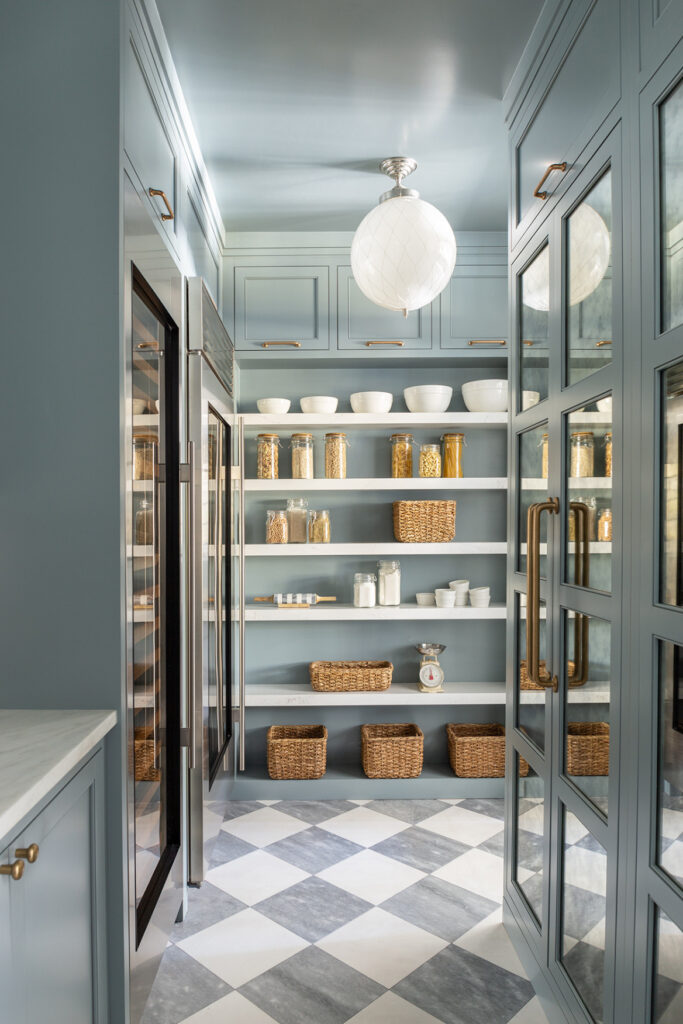 Custom millwork pantry with built-in cabinetry and concealed storage solutions in a transitional family home.