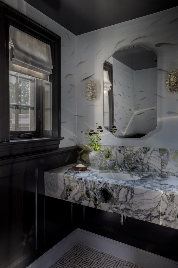 Marble powder room with coastal-inspired finishes and refined heritage detailing.