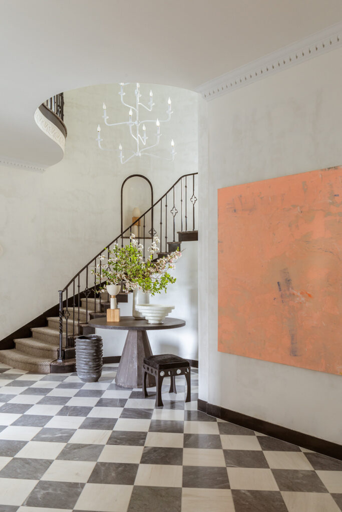 Winding staircase and foyer designed by Mimi & Hill, showcasing NJ luxury interior design with architectural, custom home detailing.