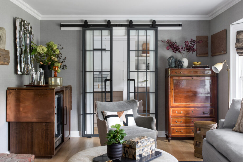 Mid-century modern ranch living room in Westfield, NJ with custom built-ins and floor-to-ceiling windows.