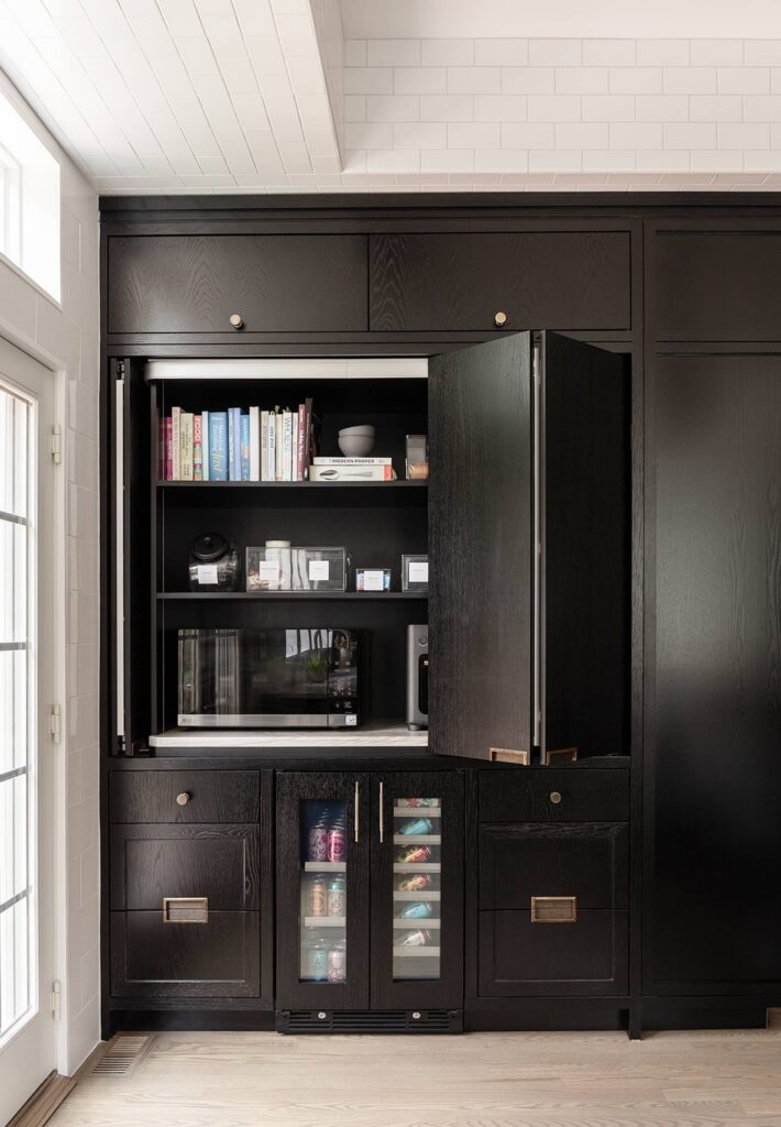 Contemporary built-in cabinet with black millwork, open shelving, and beverage storage