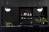 Hudson Valley kitchen with black cabinetry open shelving and marble countertops